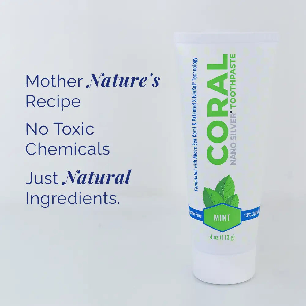 Coral Nano Silver Toothpaste bottle with text highlighting natural ingredients on a white background