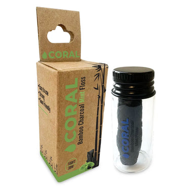 Bamboo charcoal mint floss with packaging on a white background