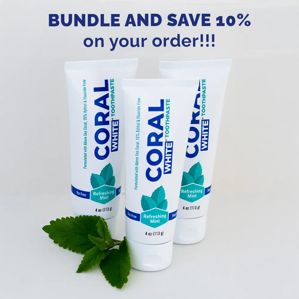 Coral White fluoride-free toothpaste mint bundle with three tubes, shown with fresh mint leaves and a bundle-and-save promotion.