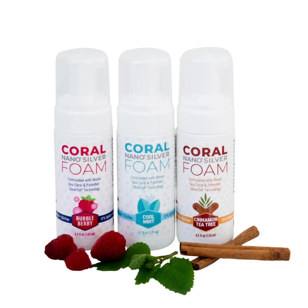 Three bottles of Coral Nano Silver Foam with different scents on a white background.