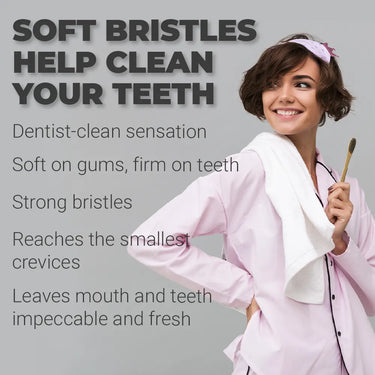 Smiling woman in pink pajamas holding a bamboo toothbrush with towel over shoulder, standing beside bold text reading “Soft bristles help clean your teeth.” Promotional image for eco-friendly toothbrush emphasizing dentist-clean sensation, gentle on gums, strong bristles, and fresh oral hygiene benefits.