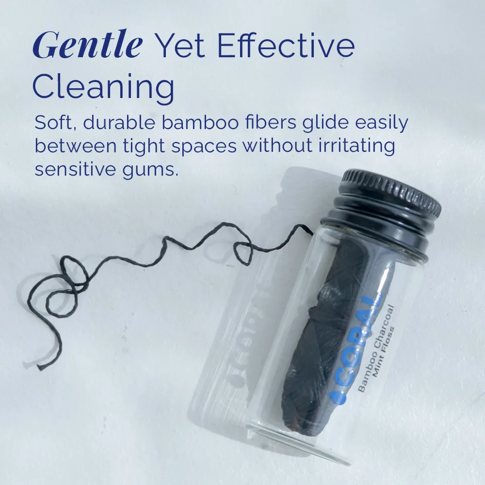 Coral bamboo charcoal mint floss shown in reusable glass container, designed for gentle yet effective cleaning between teeth without irritating sensitive gums.