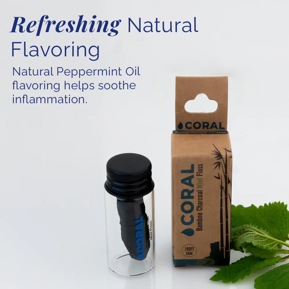 Coral Bamboo Charcoal Mint Floss displayed in a reusable glass bottle and eco-friendly cardboard packaging, featuring refreshing natural peppermint oil flavoring designed to gently clean between teeth, freshen breath, and support gum health.