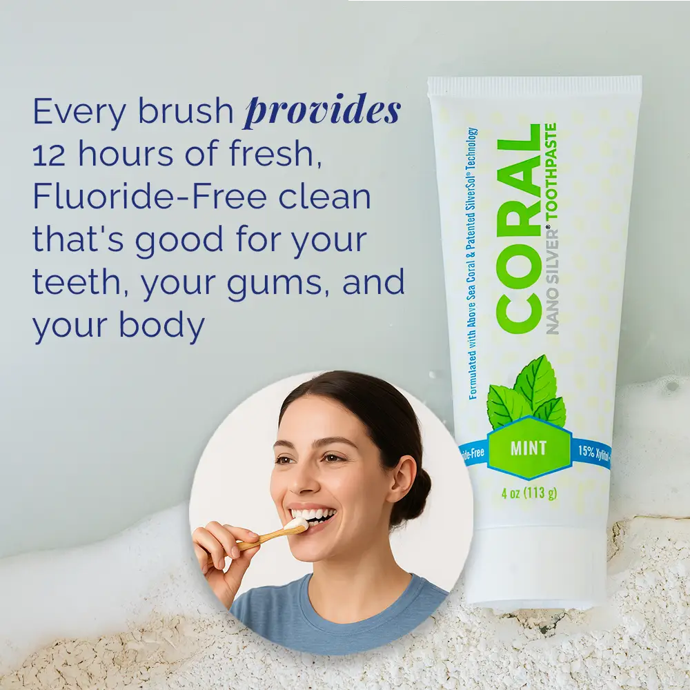 Coral Nano Silver Toothpaste tube with a woman brushing her teeth, on a light gray background.