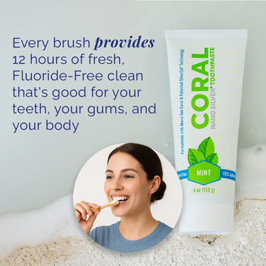 Coral Nano Silver Toothpaste tube with a woman brushing her teeth, on a light gray background.