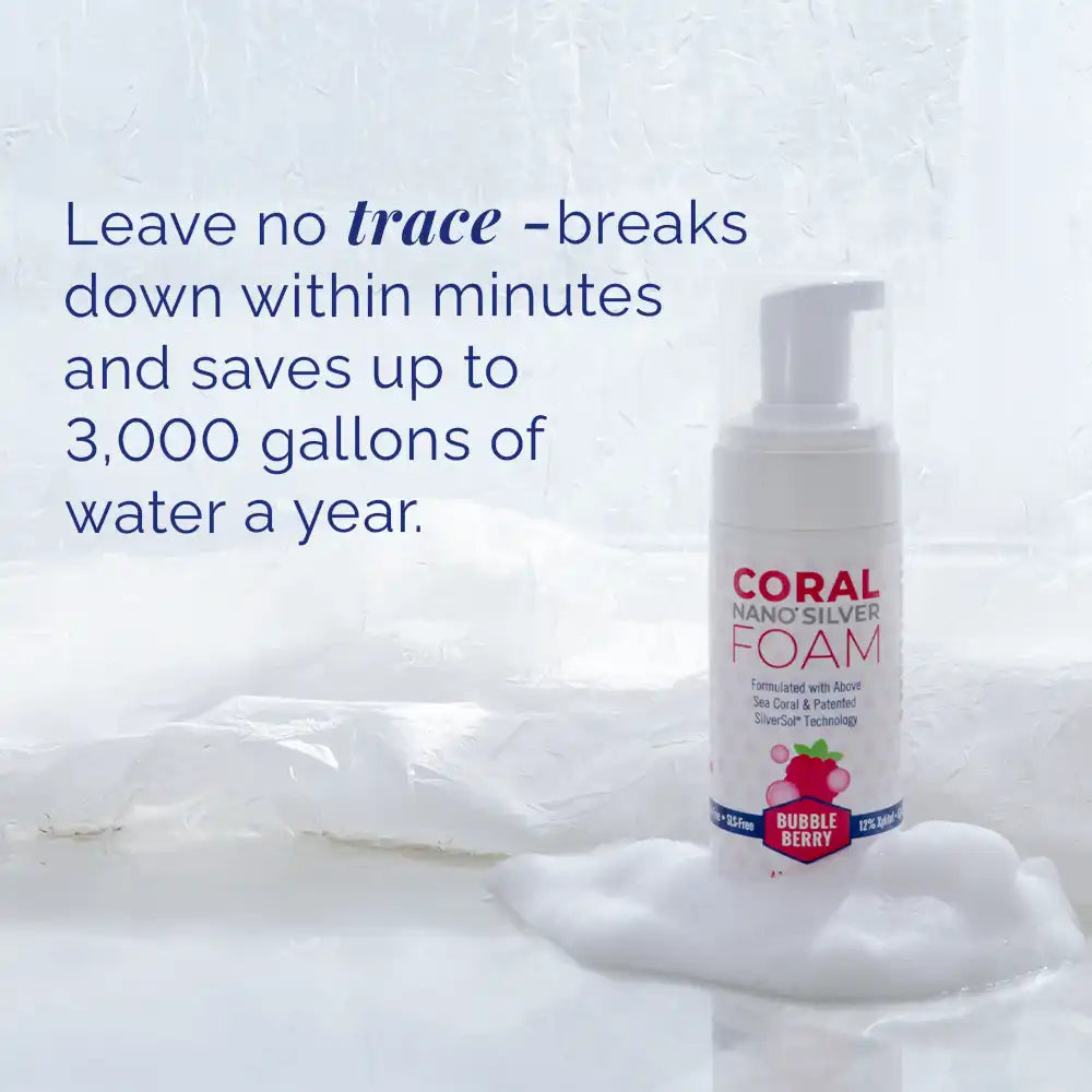 Coral Nano Silver Foaming Toothpaste Bubble Berry flavor bottle on foamy surface with text that reads: Leave no trace – breaks down within minutes and saves up to 3,000 gallons of water a year. Eco-friendly, water-saving, fluoride-free toothpaste formulated with above sea coral and patented SilverSol technology..