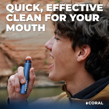 Man using Coral Mouth Spray outdoors with text “Quick, effective clean for your mouth.” Promotes portable oral care for instant freshness, natural ingredients, and eco-friendly on-the-go hygiene.