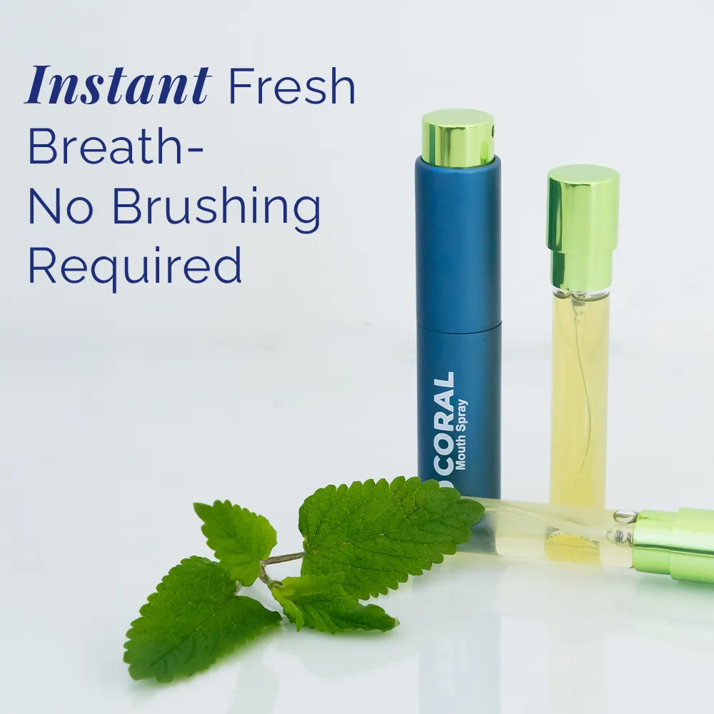 Coral Mouth Spray Mint 10ml providing instant fresh breath with no brushing required, shown with refill vial and fresh mint leaves in a reusable blue aluminum bottle