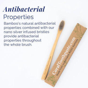 All-natural bamboo toothbrush with nano silver–infused bristles and antibacterial properties, shown with sustainable MOSO bamboo packaging on a white background