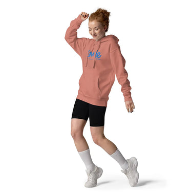 Person wearing a pink hoodie with text, black shorts, white socks, and white sneakers on a white background