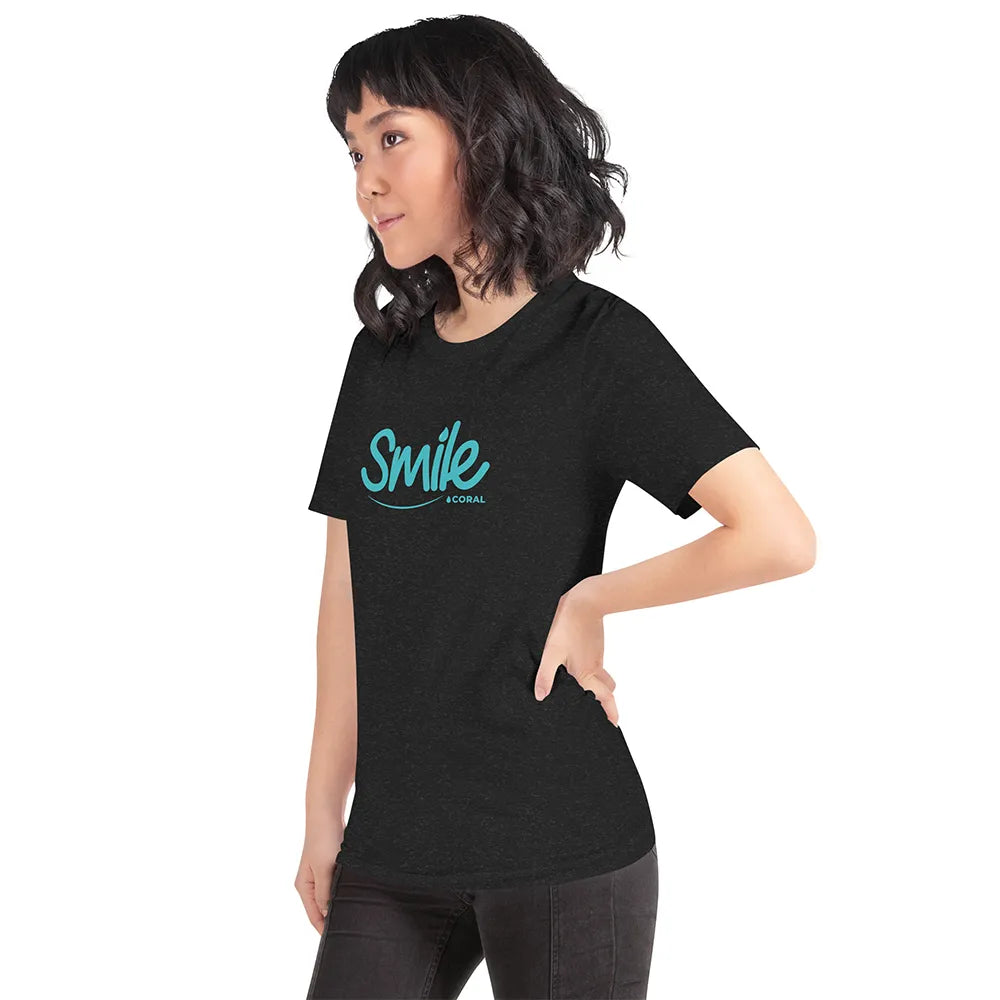 Person wearing a black t-shirt with 'smile' text on a white background