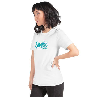Person wearing a white t-shirt with 'Smile' printed on it against a white background