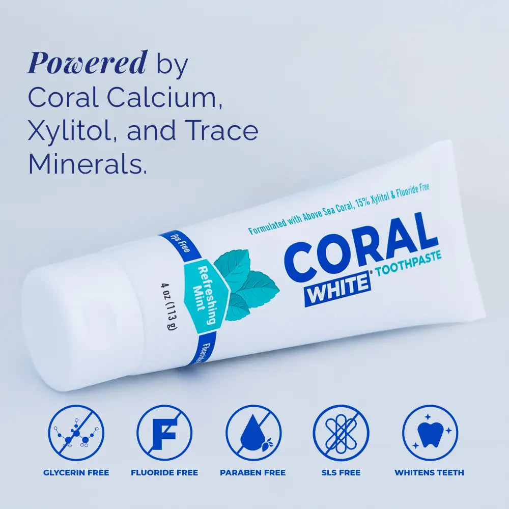Tube of Coral White toothpaste with product features listed on a light blue background
